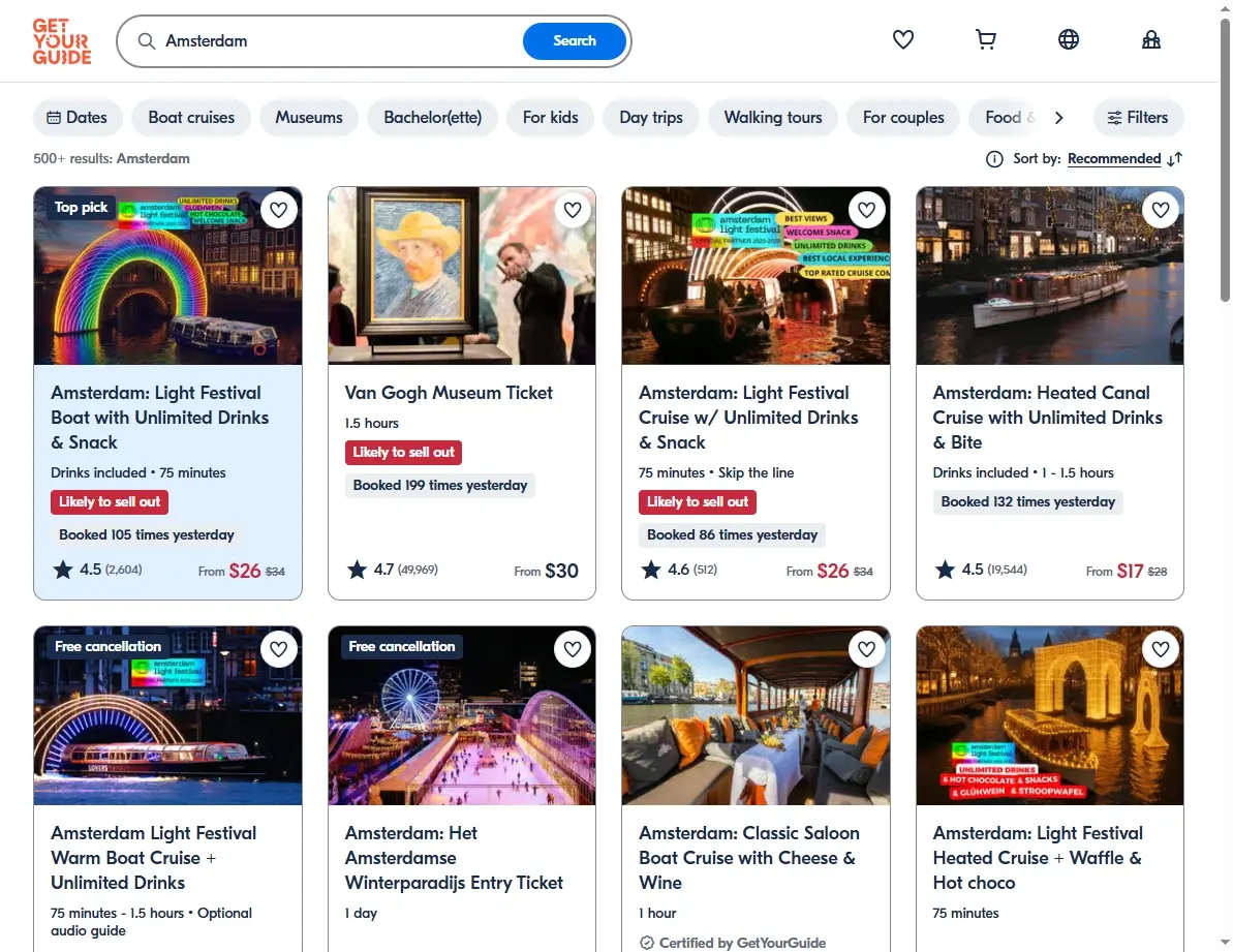 A screenshot of various Amsterdam activities and tour offers on a booking website.